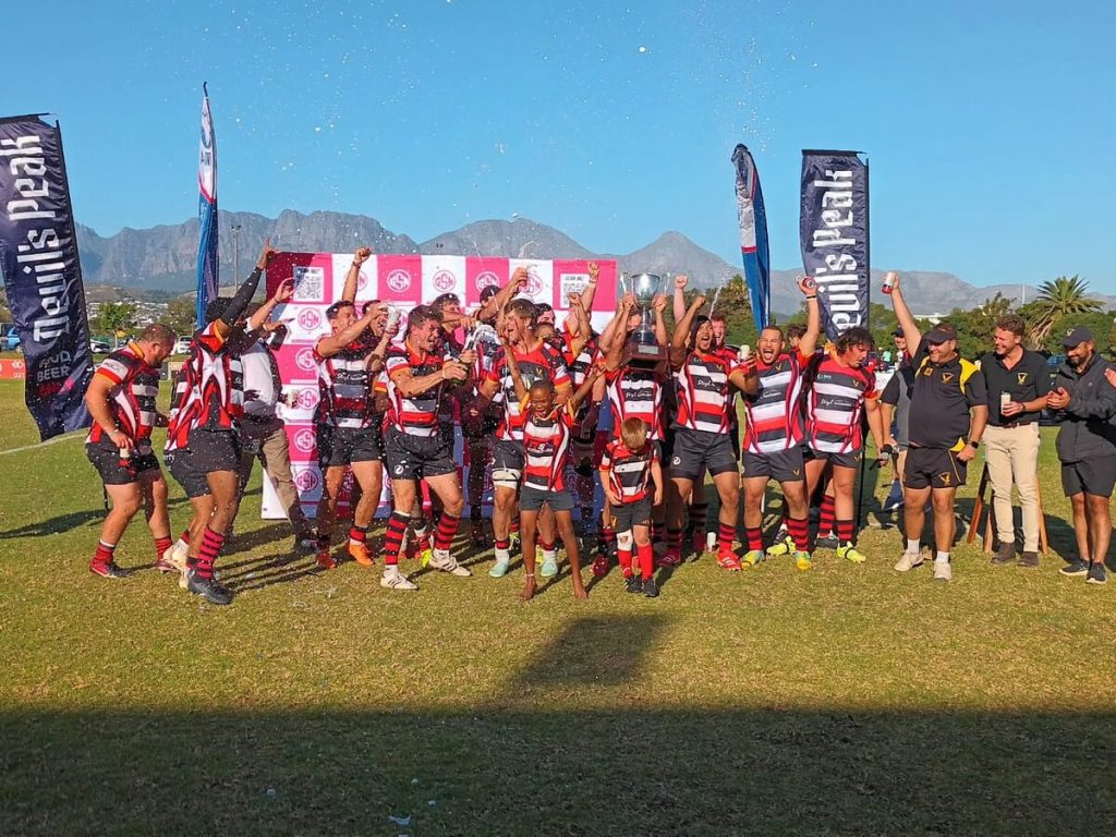 Helderberg Rugby Club's first team celebrating their victory in the Cup final of the Rugby Reloaded tournament at Charles Morkel Stadium on Saturday (7 March).