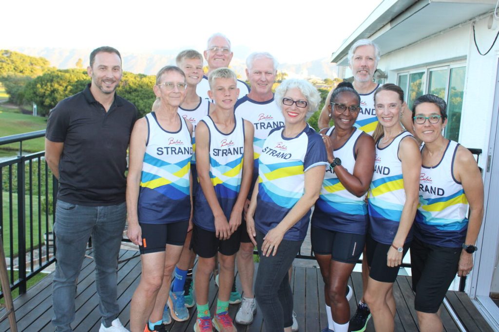 Ryan Kalk (far left) of Balwin Properties with some of the club runners in their new kit. Photos: Yaseen Gaffar