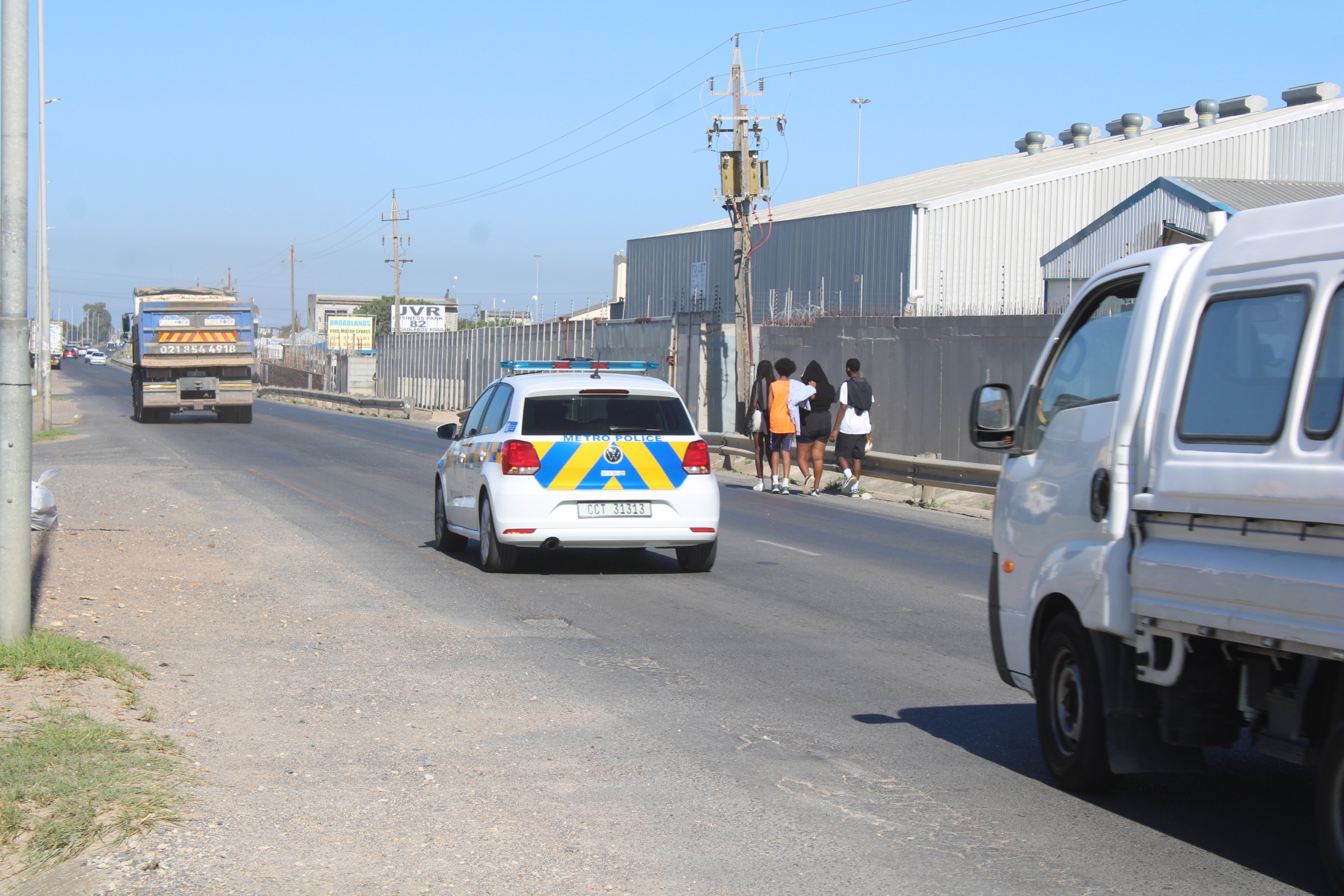 The lack of a sidewalk along Broadlands Road in Strand forces pedestrians onto the tarmac when commuting to work and school.