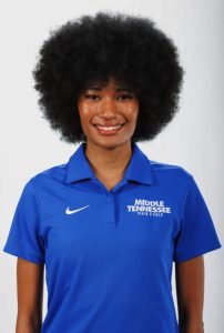 Local track star Zenade October finds her rhythm in the USA