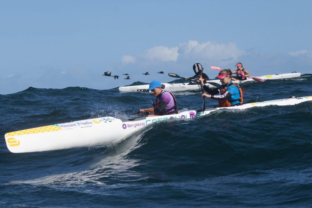 Kira Bester (extreme left) and Melanie van Niekerk successfully defended their title at the Prescient Freedom Paddle on Monday 27 April, but had to fight off a strong challenge from Saskkia Hockly (obscured) and Rosie Edwards (behind, right). Photo: Madison Malherbe/Lens of Nahoon /Gameplan Media