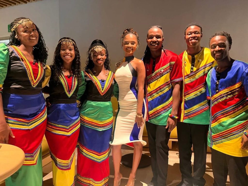 The Mzansi Youth Choir, dressed by Sanette van Schalkwyk, with Tyla at the opening of the FIFA World Cup.