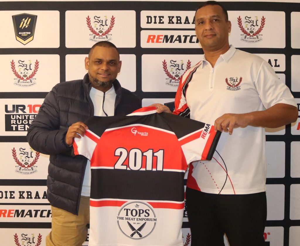 Taariq van der Ross presenting personalised jersey to Yoemnah Waggie, owner of Tops Butchery