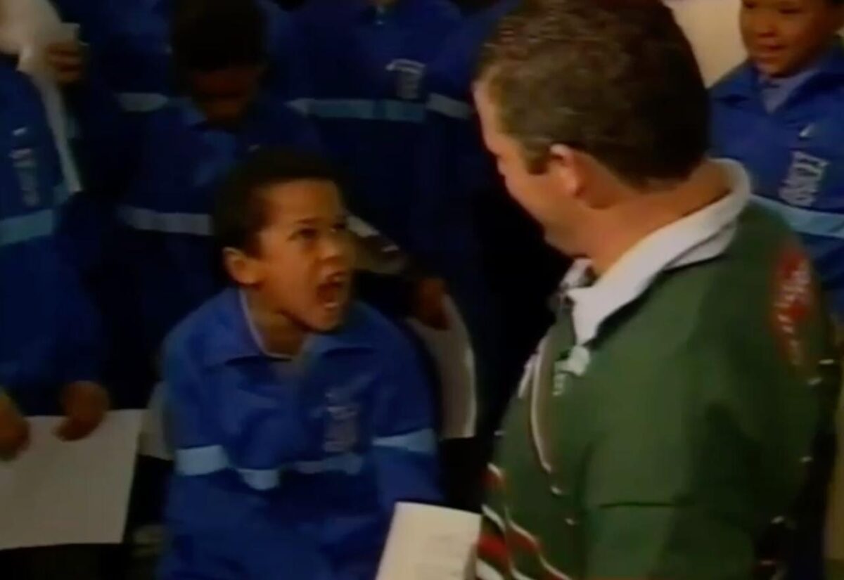 Lyndon Julius, aged 10 years at the time, performing the Metho Spirit for former All Blacks captain Sean Fitzpatrick in Somerset West in 1996.