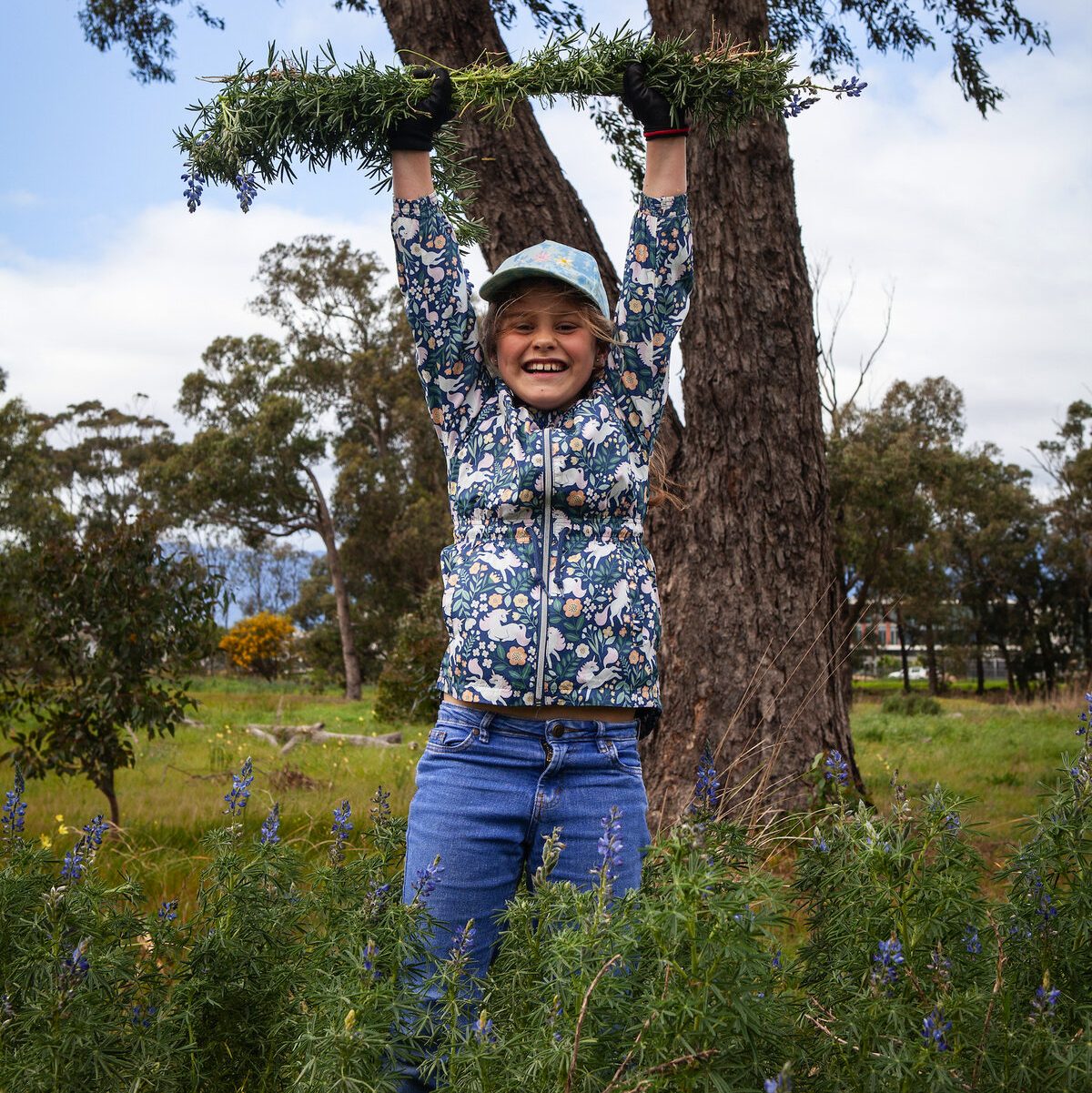 Mae Winzker clearing invasive species at Paardevlei environmental hack.