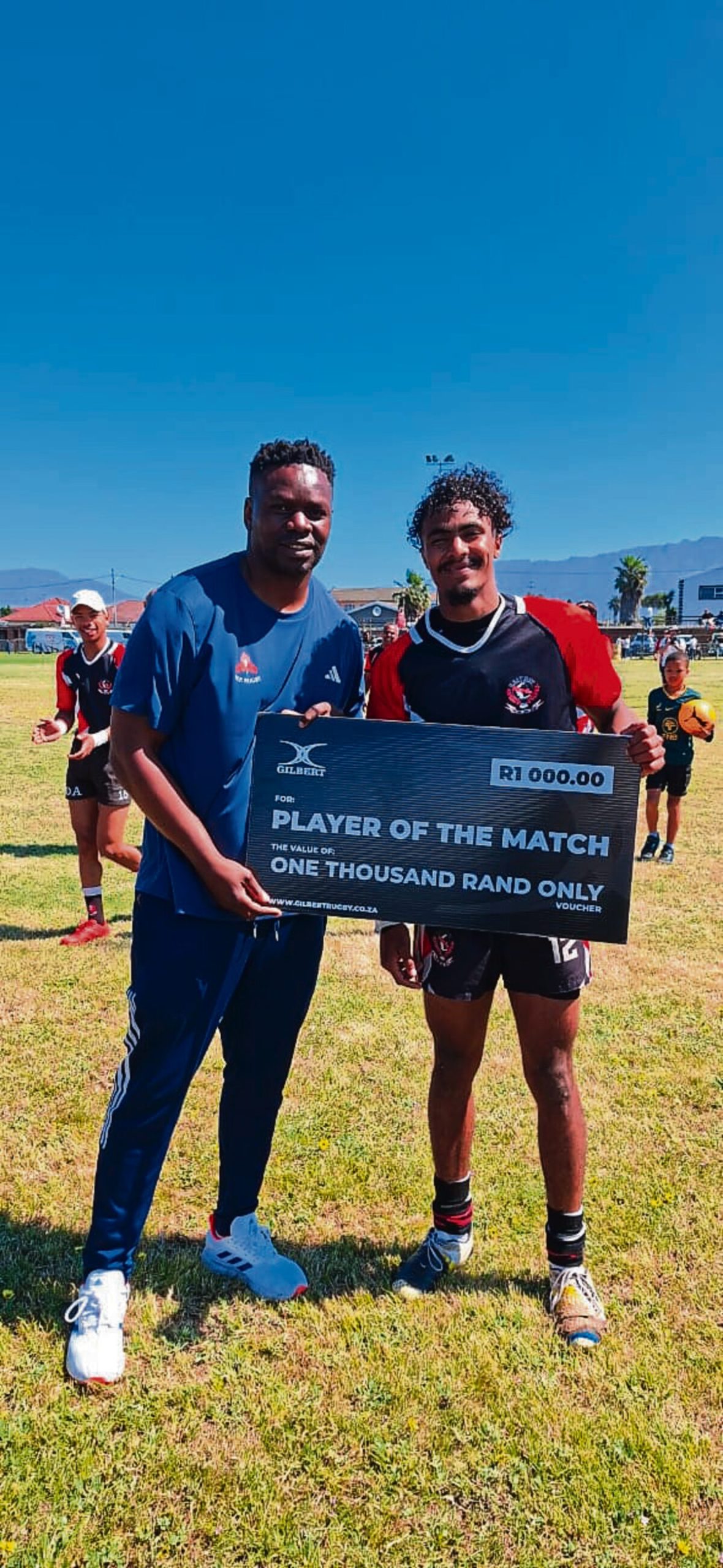 Raithy's Man of the Match O'Ryan Gordon receive a cheque of R1000 from WP Rep.