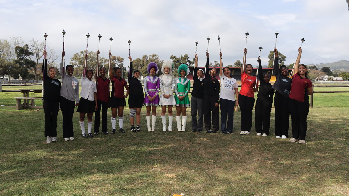 HHH majorettes raising their batons.