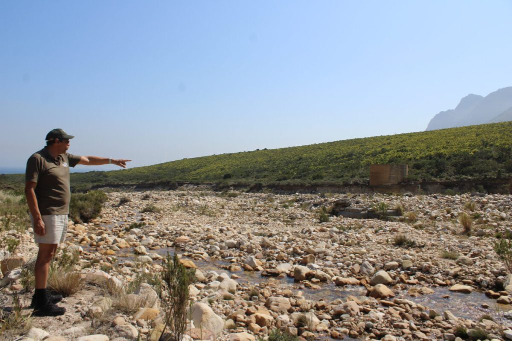 Nature conservation head Roy Ernstzen points to where water infrastructure supplying Kogel Bay and surrounds was damaged during heavy storms in 2022 and 2023. Photos: Yaseen Gaffar
