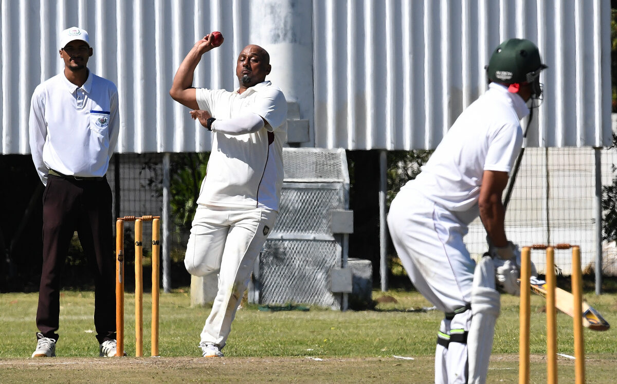 Veteran bowler for Helderberg CC Ebrahiem Latief,  lines up another delivery.