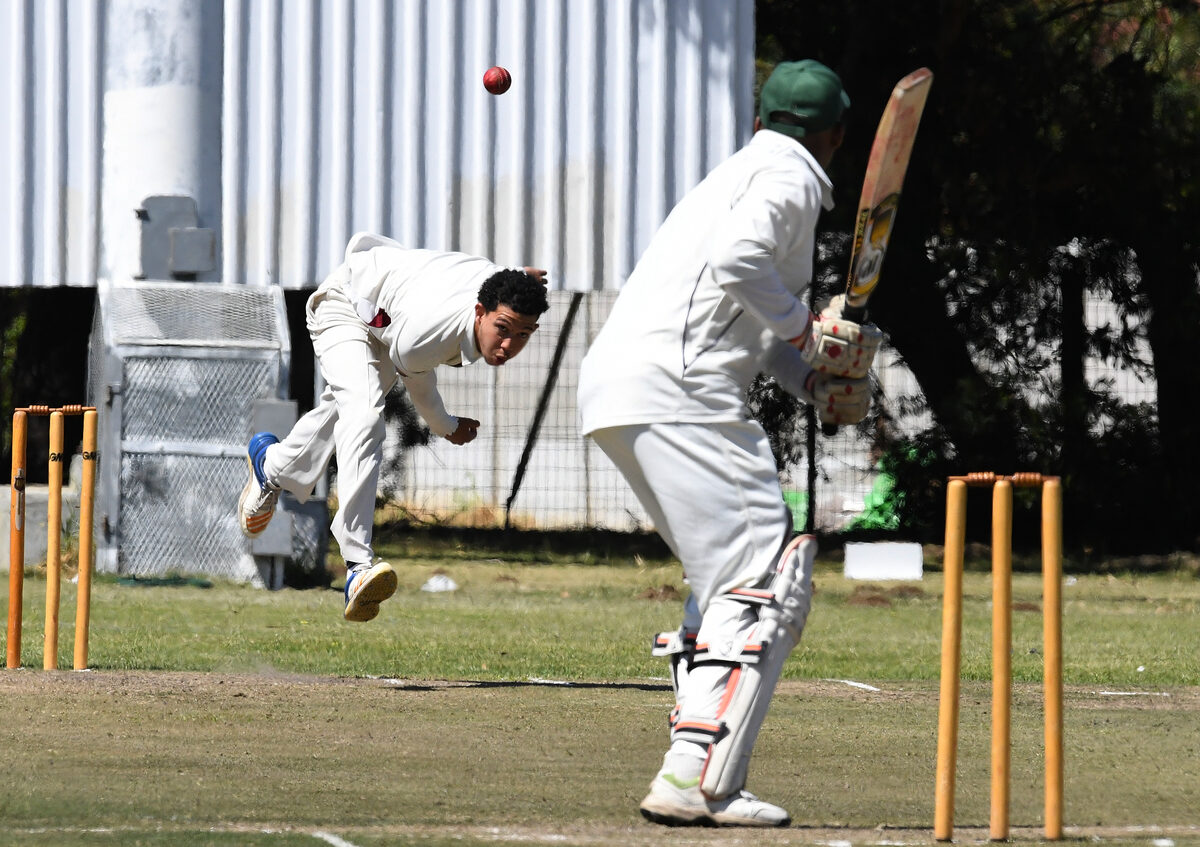 Sharick Swarts puts in the effort with a delivery for Helderberg CC. Photo: Peter Bee