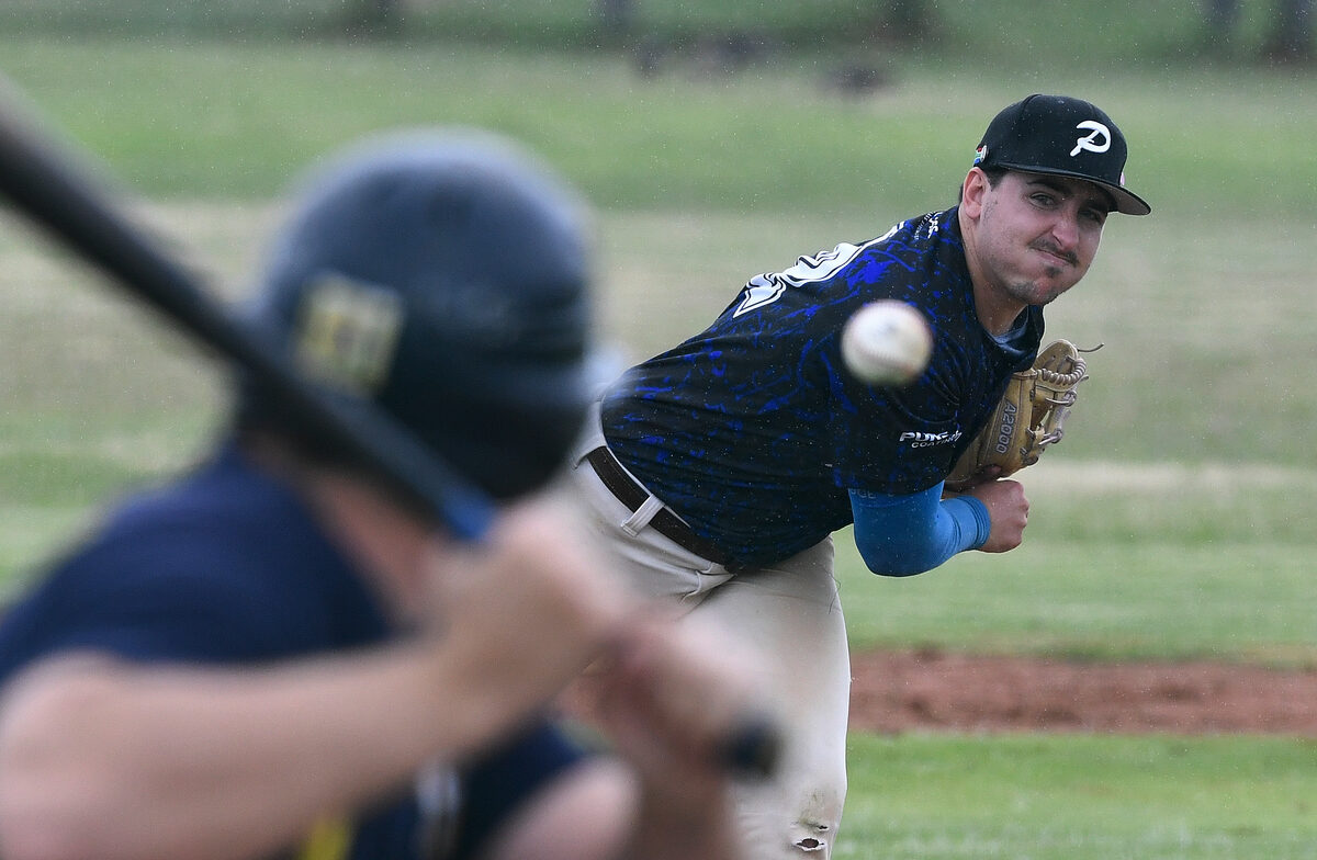 Cole Quattrocecere, a pitcher for Helderberg Pirates, sends in another tricky pitch. Photos: Peter Bee
