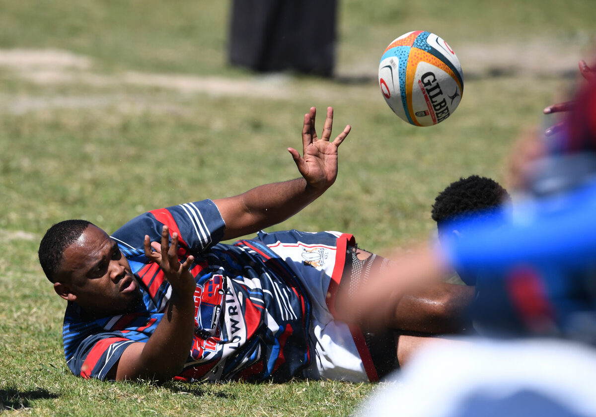 David Erasmus offloads the ball for Sir Lowrians.