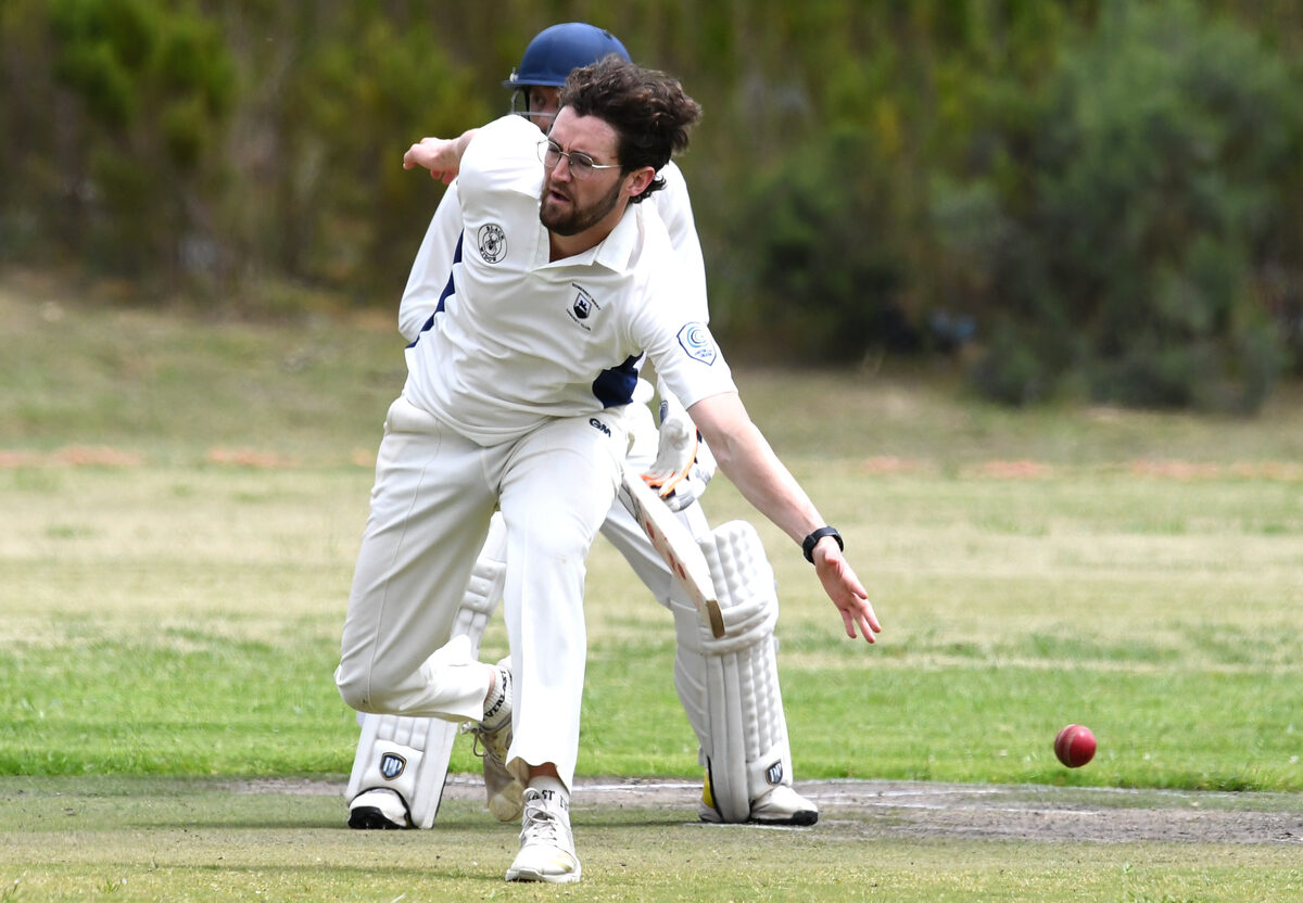 Cameron Hewson of SWCC attempts to field a ball off his own bowling.