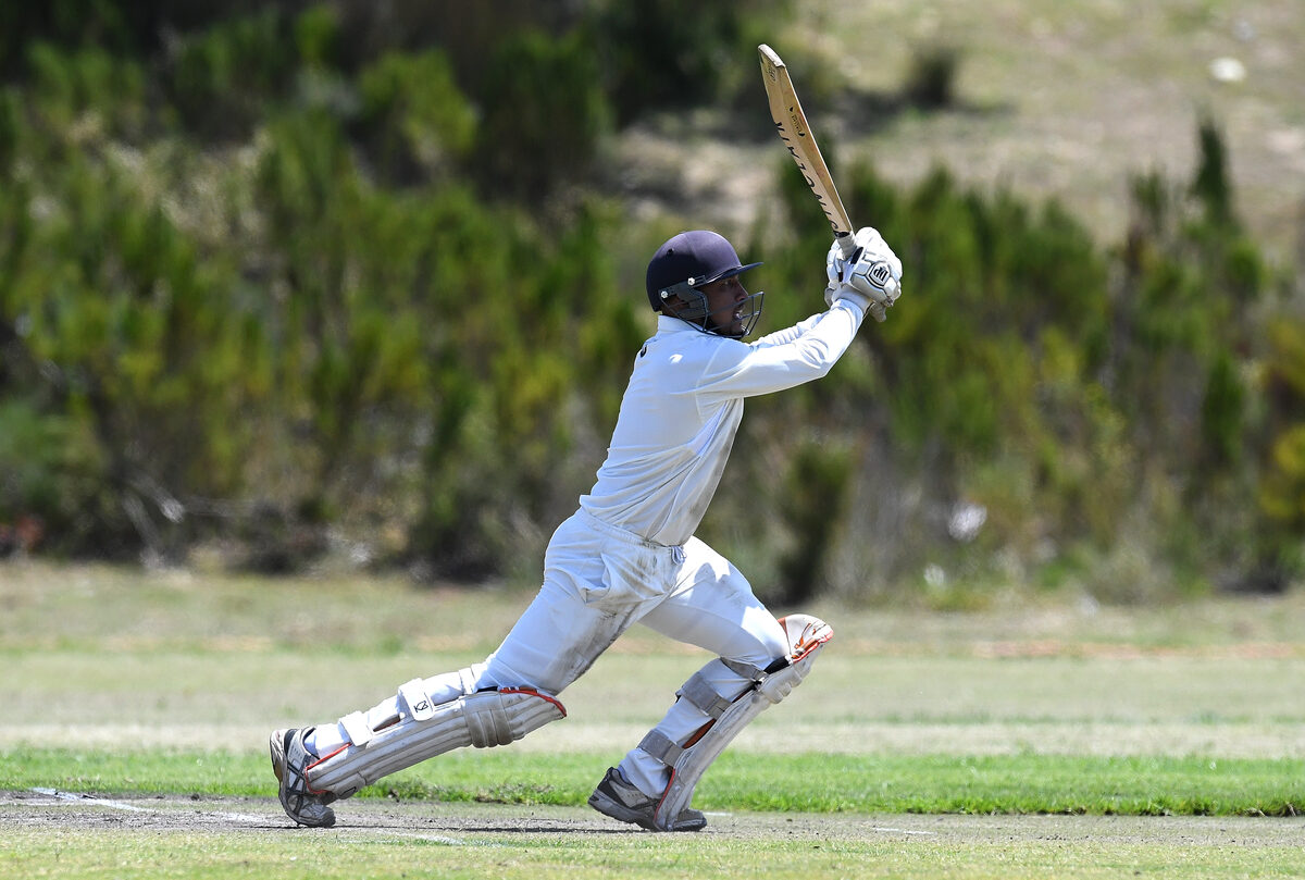 Helderberg Cricket Club's Junaid Sylvester goes over the top during his team's derby encounter against Somerset West Cricket Club at Radloff Park on Saturday (24 October). Photos: Peter Bee