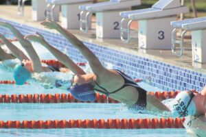 Rhenish swimmer wears green and gold