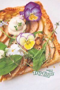 Pear tart with cashew cream cheese and garden greens