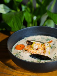 Creamy prawn and corn chowder with chives and crusty bread