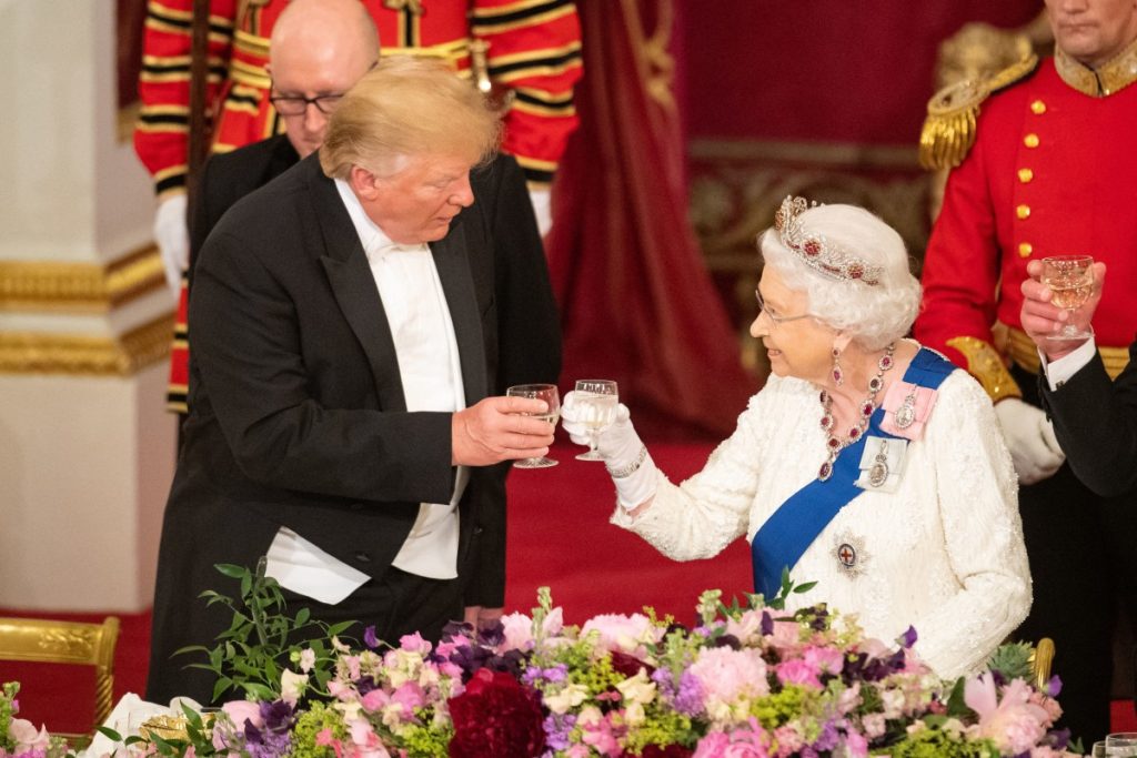 Britain's Queen Elizabeth II raises a glasses with US President Donald Trump during a State Banquet in the ballroom at Buckingham Palace in central London on June 3, 2019. (Photo by Dominic Lipinski / POOL / AFP)