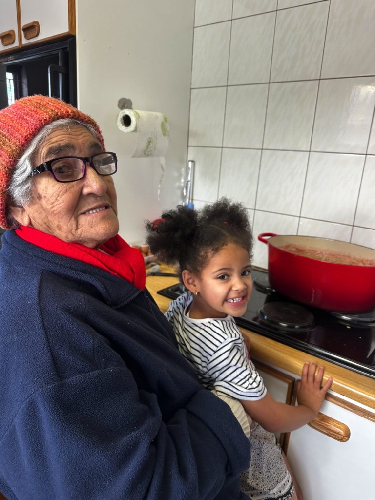 Jamestown's ice cream and strawberry queen, Ma Ivy helps her great-gradndaughter, Annelyn, with preparations for the monthly Jamestown Street Market.
