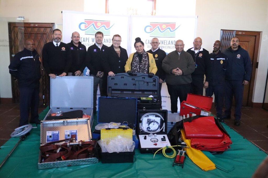 At the handover of the hazmat equipment are CWDM Fire Services officials and partners, including Wayne Josias (chief fire officer, second from left), Ettiene du Toit and Colin Deiner (Western Cape Disaster Risk), Amanda de Willet (deputy director of Policy & Strategic Support: Provincial Fire Services), Dr Elna von Schlicht (CWDM executive mayor), Reggie Farao (Mayoral Committee member: Fire Services), Pietie Williams (executive director: CDPS-CWDM), and Piet du Plessis (regional commander: CDPS-CWDM).