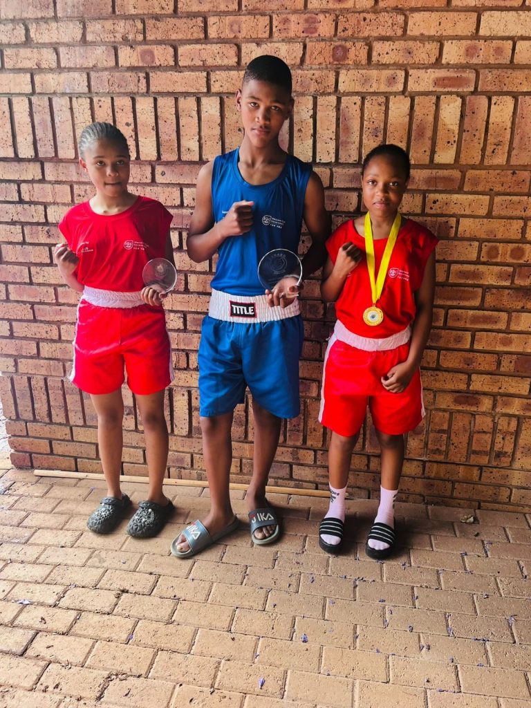 The Khayamandi Boxing Academy proudly celebrated its newest two-time South African boxer Amahle Mthelo (right) recently. At just 14 years old, she has already made a name for herself after competing in the 2025 South African National Boxing Organisation  Championships, held in Rustenburg from Tuesday 7 to Saturday 12 October. Amahle was crowned the best female boxer and also won the award for "best fight of the tournament". Fellow club members Luthando Mayongo and Endinako Nqolose competed alongside Amahle. The management of Khayamandi Boxing Academy is very proud of the young champion's achievements and looks forward to more successes and wins in future.