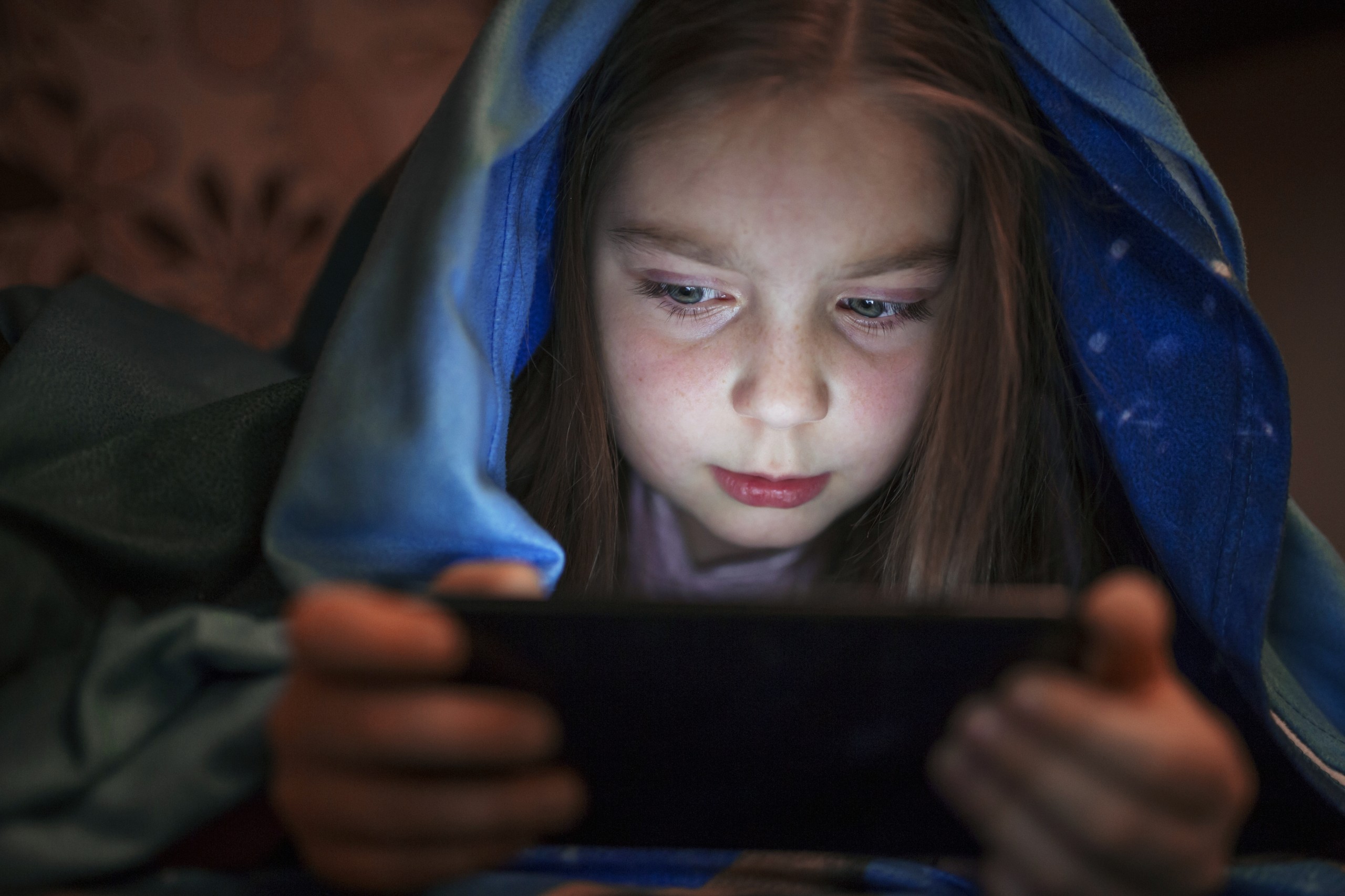 girl using smartphone at night