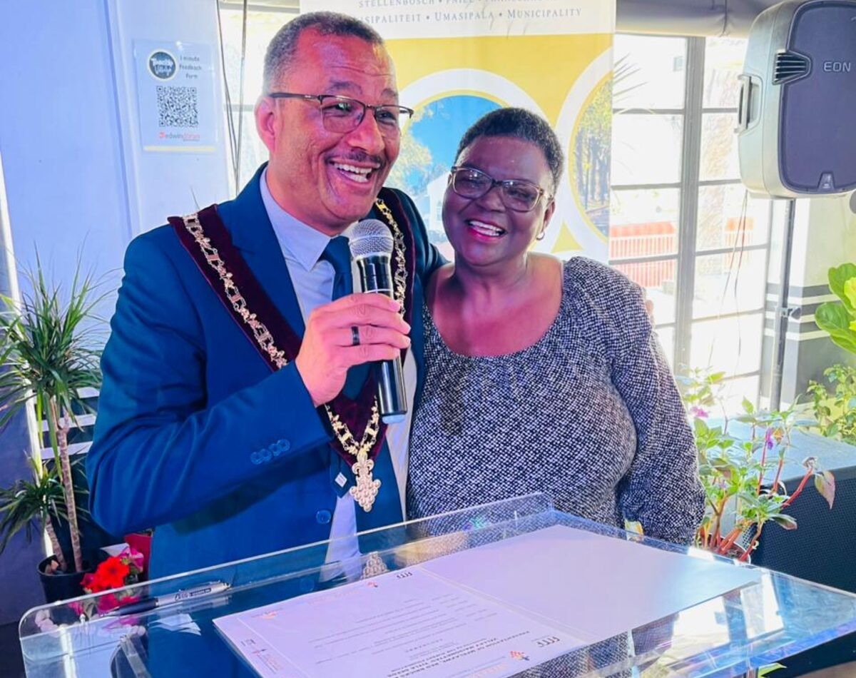 Stellenbosch mayor Jeremy Fasser with Ward 13 councillor Mary Nkopane at the handover of title deeds in Khayamandi.