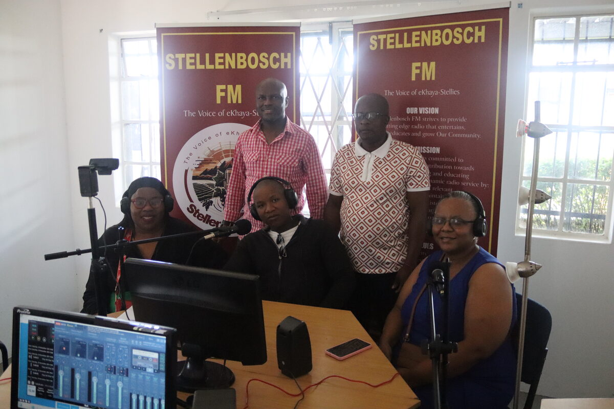The Stellenbosch FM team (back, from left) are Tau Mokhele and Mohau Monaheng, with presenters Nompumelelo Ngemntu, Sinalo Sigenu, Beauty "Mam Mya" Myataza seated. Photo: Yaël Malgas