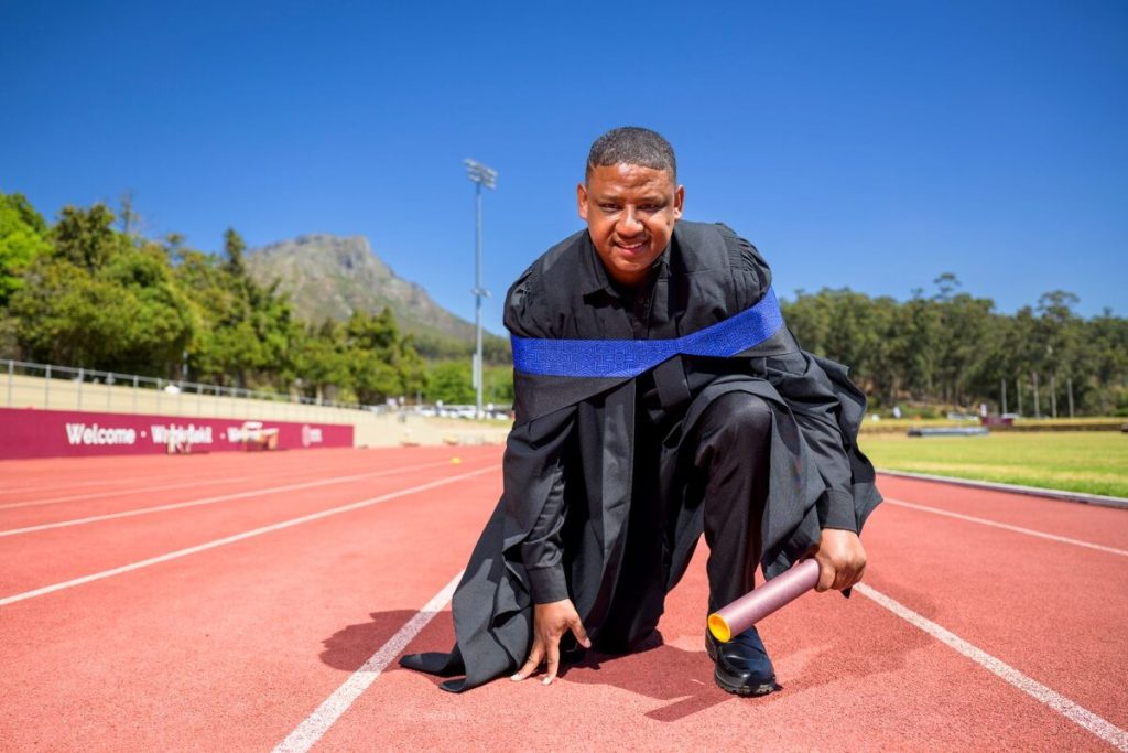 Dyan Buis celebrates his Master's degree graduation from Stellenbosch University, adding academic achievement to his Paralympic sporting success.