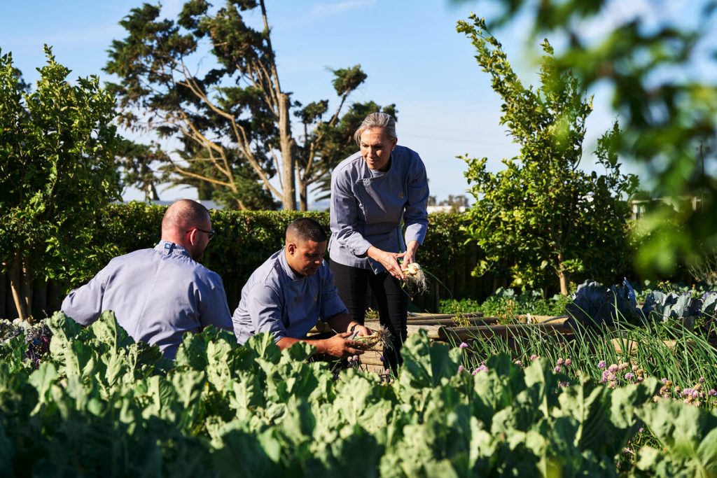 Michelle Theron and some of her culinary team members in the garden of the historic estate. Photo: Sean Gibson