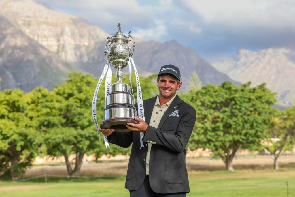 Casey Jarvis celebrates with the championship trophy after winning the 115th Investec South African Open Championship at Stellenbosch Golf Club on Sunday (1 March). Photo: Carl Fourie/Sunshine Tour