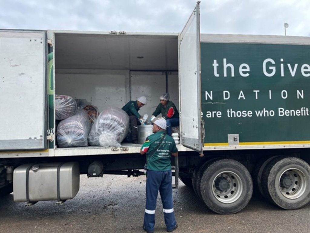 Members of the humanitarian organisation Gift of the Givers preparing to hand food and blankets over to the affected community members of Enkanini informal settlement. Photo: Hlomla Mdala