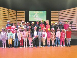 Children usher spring in with new hats