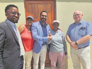 Houses, title deeds handed over