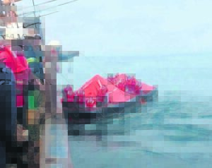 Crew evacuates burning vessel