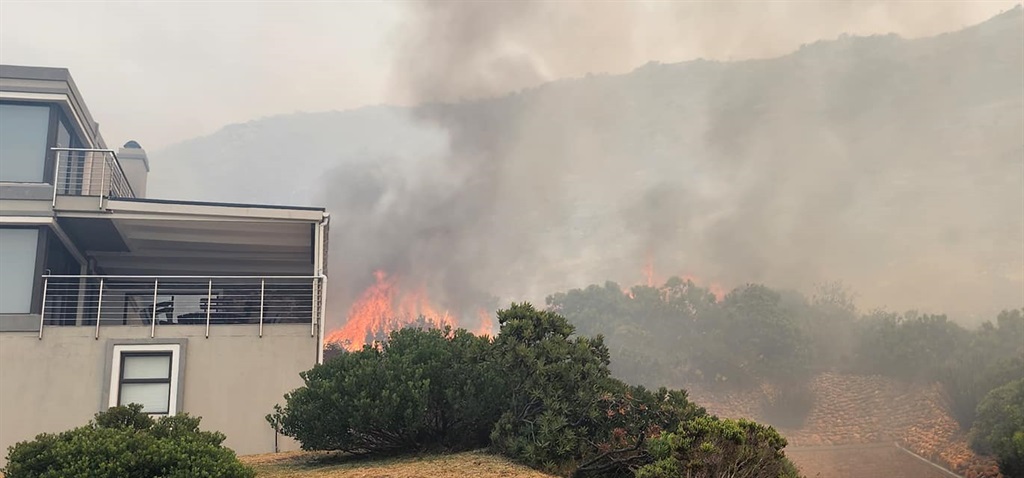 Towering flames fanned by strong winds wreaked hav