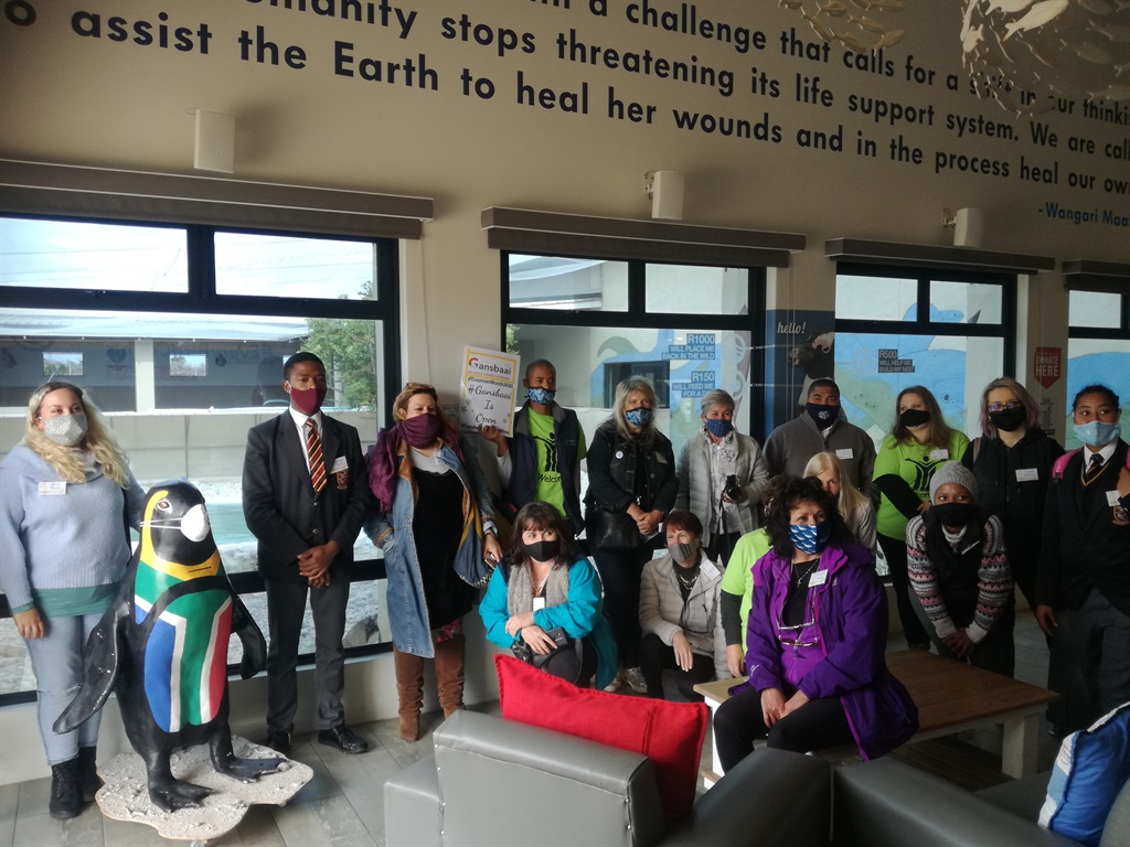 A group photo with a masked penguin at the the Afr