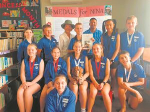 Nina the muse visits local library