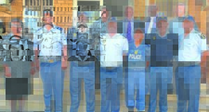 Police climb up the ladder