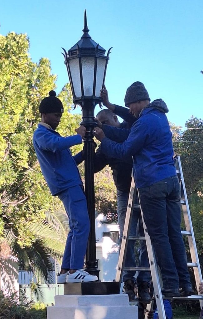 The lantern being installed in the Reinet House garden during the unveiling.