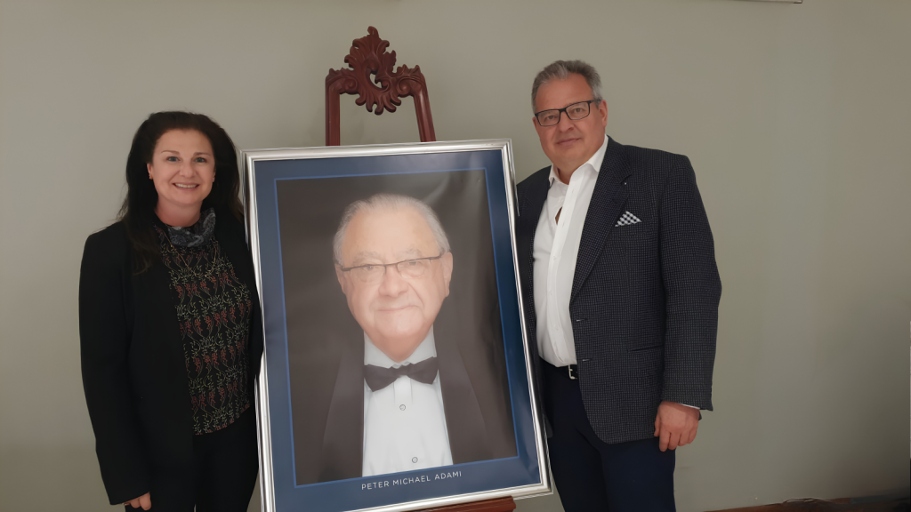 Man and women holding a picture frame