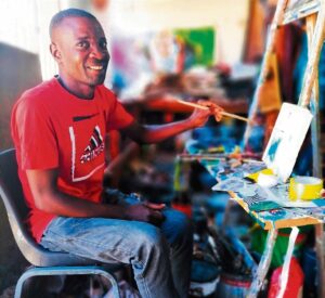 ’n Motor met ‘versameloë’ en inloer by kunstenaar