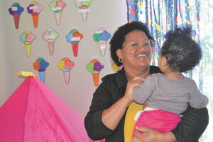 Pre-school principal helps teen mums focus on education by taking care of babies