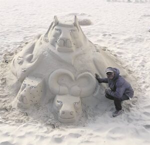 Sand artist shares art on J’Bay beaches