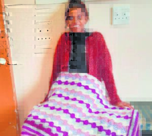 Elderly volunteer knits blankets for terminally ill patients