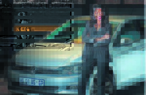 Young woman’s zest for life . . . and cars