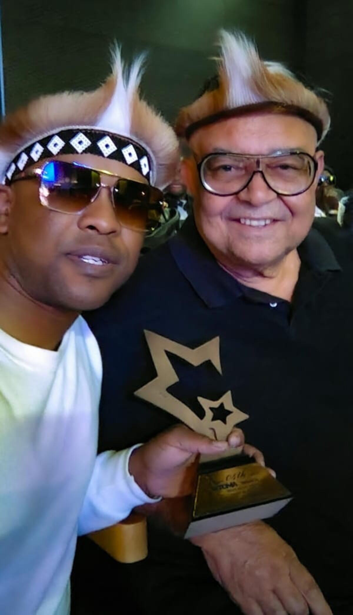 Siyabonga George and Lance Stehr showcasing Siyabonga's new trophy.