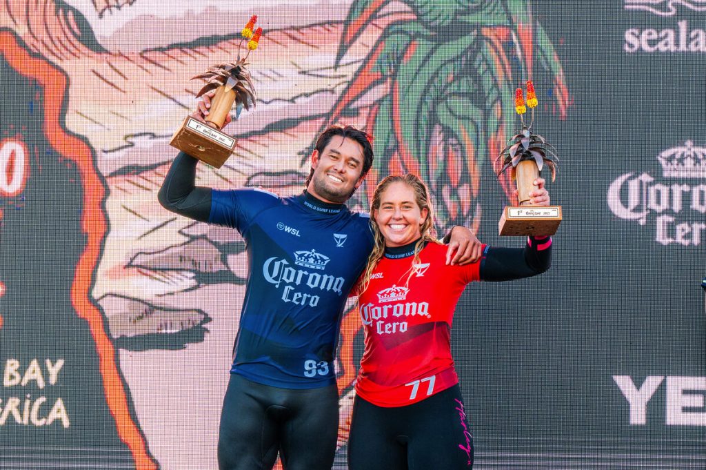 Connor O'Leary of Japan and Gabriela Bryan standing next to each other, holding up their trophies.