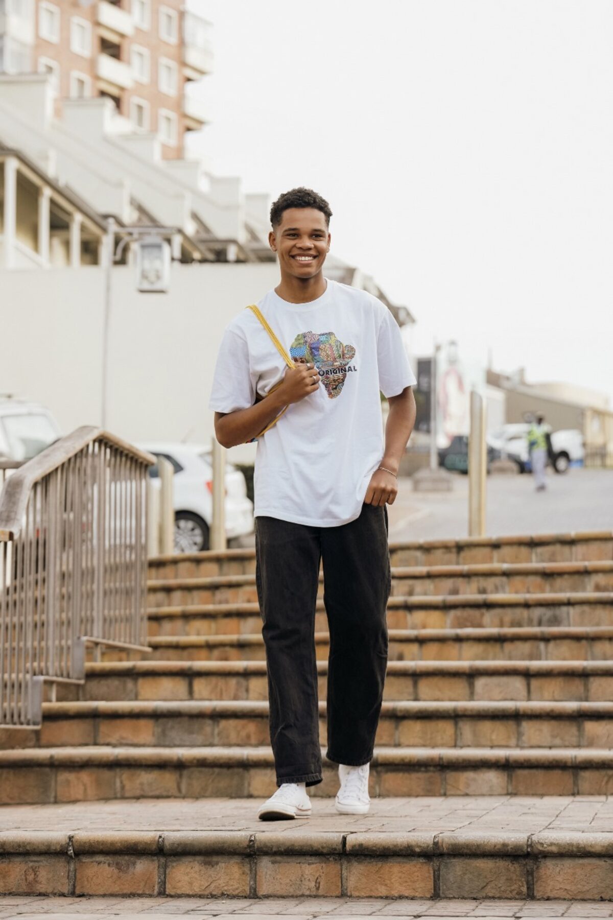 Joshua Jansen walking down a staircase.