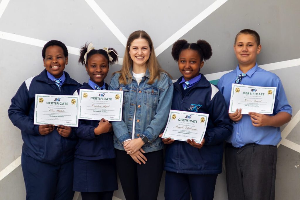 Elam Mhlobo, Vuyelwa Sipali, Kaylin Kleinhans, Ibanathi Vitealingum and Ciaran Brand proudly display their certificates of achievement for placing 7th overall.